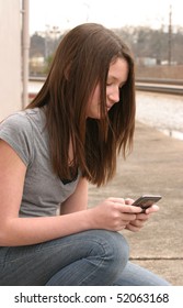 Teen Girl Using A Cell Phone