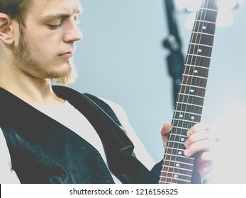 Teen Hardcore Man Wearing Metal Outfit Playing On Electric Guitar Heavy Rock Music Teen Hardcore Man Wearing Metal Outfit Playing On Electric Guitar Heavy Rock Music