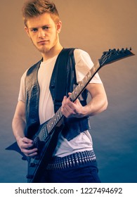 Teen Hardcore Man Wearing Metal Outfit Playing On Electric Guitar Heavy Rock Music Teen Hardcore Man Wearing Metal Outfit Playing On Electric Guitar Heavy Rock Music