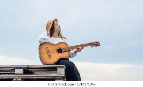 Teen Hipster Playing On Guitar. Singer With Acoustic Guitar. Music And Art. Musical Shop. Happy Girl Enjoy The Moment. Have Fun On Celebration. Kid Singing With Guitar.