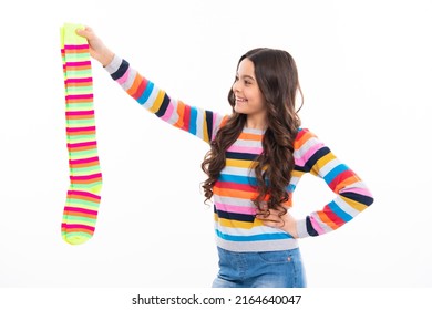 Teen hold strip sock on white background. Child holding a pair of stripped socks.