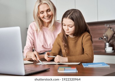 Teen Kid Girl Distance Learning Virtual Distance Online Class On Video Call Virtual Lesson With Mum, Studying At Home Using Laptop Computer. Mother Helping Child Daughter With Elearning Remote Class.