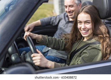 A Teen Learning To Drive Or Taking Driving Test.