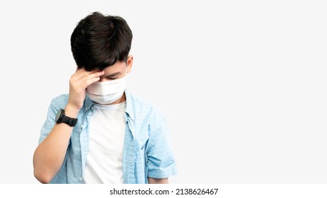 Teen Mental Health During COVID-19 Concept. Portrait Of An Asian Teenager Boy With Medical Face Mask, Face Down Hands Cover His Face. Stressful, Anxiety, Illness, Infected, Cyberbully, Pandemic.