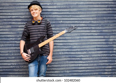 Teen Musician Portrait With Guitar Outdoors