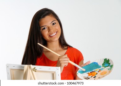 Teen Painting A Canvas On White Background