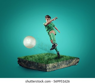 Teen Playing Soccer On A Cube Of Grass.