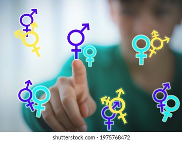 Teen Problem Family Issues Gender Confusion In Teenager. A Teen Boy Pointing At Gender Symbols Of Male Bigender And Transgender. Concept Of Choice Gender Confusion Or Dysphoria.