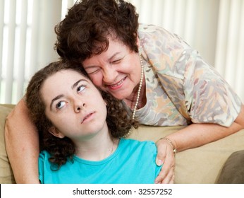 Teen Puts Up With A Hug From An Annoying Aunt Or Parent.