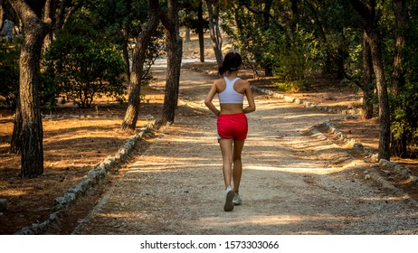 teen in running shorts