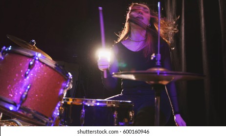 Teen rock music - girl with flowing hair percussion drummer performing with drums - Powered by Shutterstock