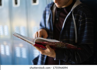 Teen At School Lockers Studying