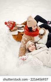 Teen Siblings And Their Mother Having Fun At Winter Park