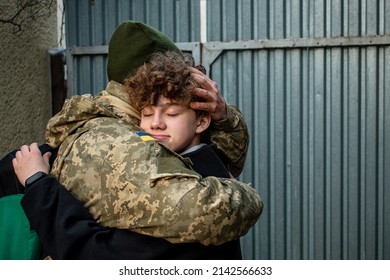 Teen Son Says Goodbye To Her Military With His Eyes Closed. Son Hugs A Dad Ukrainian Soldier. Ukrainian Defender Says Goodbye To His Family. Mobilization Of Ukrainian Men. War In Ukraine.