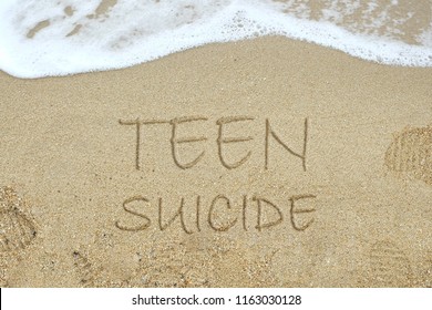 Teen Suicide Concept Using Sands At Beach