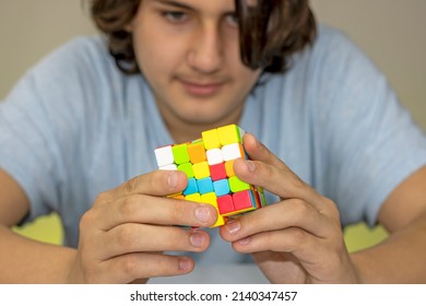 Teen Turning A Magic Cube