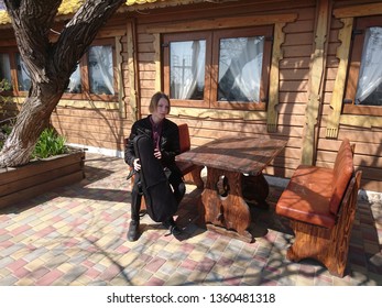 Teen Violinist Sitting In An Old Cafe