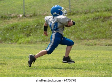 Teen Youth Football Player Running For The Touchdown