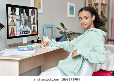 Teenage African American Girl High School Student Distance E Learning Group Online Class At Home Looking At Camera. Video Conference Call Remote Classes And Courses, Virtual Digital Education Concept.