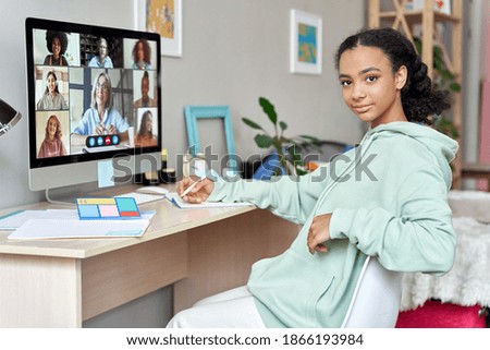 Teenage african american girl high school student distance e learning group online class at home looking at camera. Video conference call remote classes and courses, virtual digital education concept.