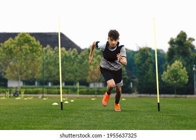 Teenage Athlete on Running Training Speed Tests. Young Boy Running Fast in Cleats and Soccer Sports Uniform. Football Practice Unit