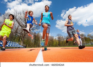 Teenage Athletes Having Fun On The Racetrack