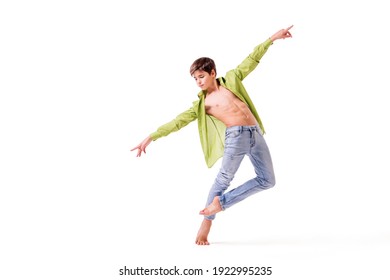 teenage ballet dancer poses barefoot, isolated on white background.