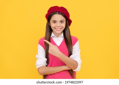 Teenage Beauty. Tween And Youth. Casual Fashion. Happy French Teen Girl Pointing Finger. Teenager Advisor. Childhood Happiness. Back To School. Cheerful Kid In Beret. Smiling Child Has Perfect Style.