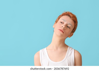 Teenage Boy With Dyed Eyebrows On Color Background