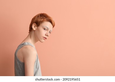 Teenage Boy With Dyed Eyebrows On Color Background