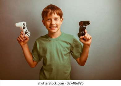 Teenage boy holding a game joystick on a blue background studio photo retro - Powered by Shutterstock