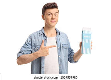 Teenage Boy Holding A Milk Carton And Pointing Isolated On White Background