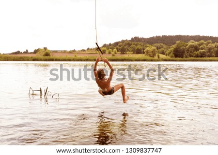 Similar – Image, Stock Photo Swimming fun at quarry pond, young adults swing into the water