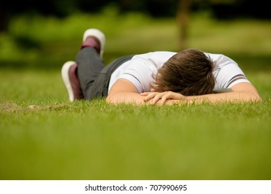 Teenage Boy Laying On Grass On Stock Photo 707990695 | Shutterstock