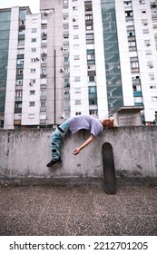 A Teenage Boy Is Lying On The Fence Outside And Feeling Misunderstood.