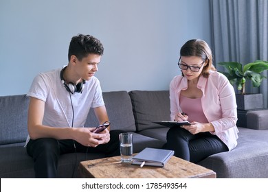 Teenage Boy At Meeting With Female Professional Doctor Psychologist. Adolescent Counseling Help, School Psychologist, Child Social Worker, Adolescent Problems