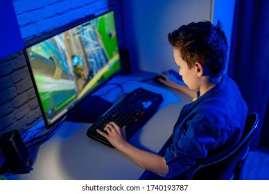 Teenage boy playes videogames. Addicted to video gaming at home