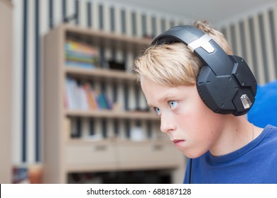 Teenage Boy Playing Computer Games On PC