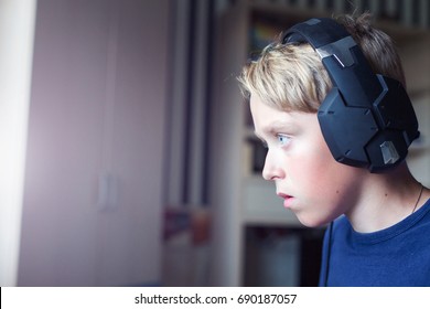 Teenage Boy Playing Computer Games On PC