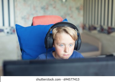 Teenage Boy Playing Computer Games On PC