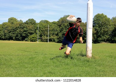 Teenage Boy Playing Rugby On A Rugby Pitch. - Powered by Shutterstock