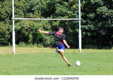 Teenage Boy Playing Rugby On A Rugby Pitch. - Powered by Shutterstock