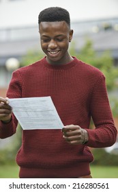 Teenage Boy Pleased With Good Exam Results