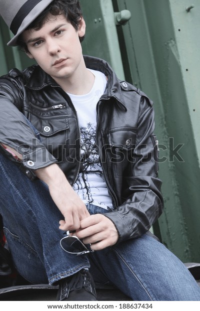 A Teenage Boy Sitting On The\
Back Of A Train; Portland, Oregon, United States Of\
America