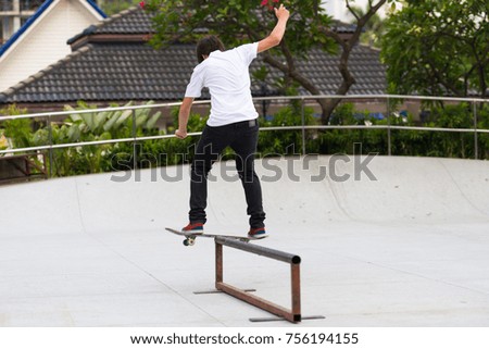 Similar – Junge Person mit Skateboard im Skatepark