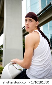 A Teenage Boy Wearing A Du Rag