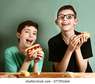 teenage boys cook hot dog happy close up smiling laughing portrait