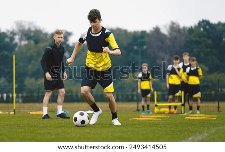 Teenage Boys Training Sports . Soccer Summer Camp for Young Boys. Happy Football Players on Practice Session. Youth Team Kicking Balls on Turf Pitch. Soccer Training Trail With Equipment