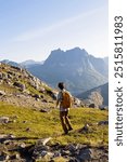 Teenage child, european boy, hikinh mountains in Norway, Senja, summertime