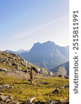 Teenage child, european boy, hikinh mountains in Norway, Senja, summertime